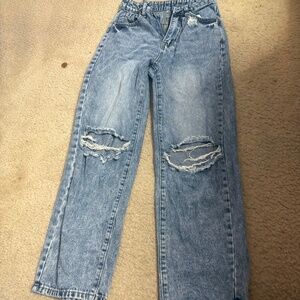 High-waisted distressed denim jeans